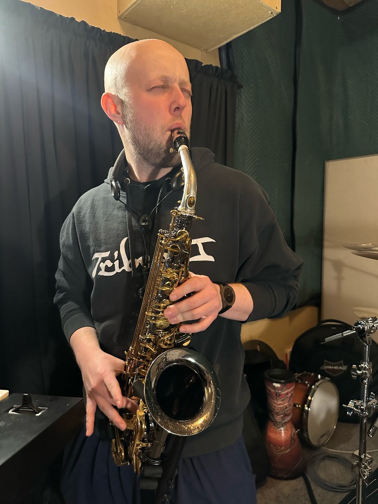 Dub Nectar saxophone player portrait in studio